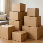 Stacked cardboard boxes in a living room setting